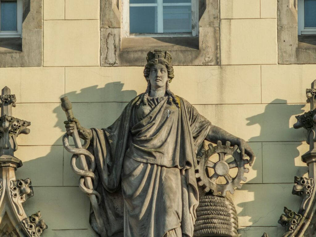 Detailed view of a classical sculpture on a historic building in Wrocław, Poland.